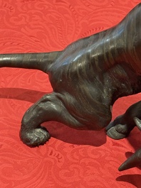 A Japanese bronze okimono of a tiger and a bull, signed Sano Takachika 佐野隆親, Meiji, 19th C.