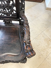 A pair of Chinese finely carved hongmu armchairs, Canton, 19th C.