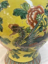 A pair of Chinese famille verte yellow-ground 'pheasants and peonies' vases and covers, 19th C.