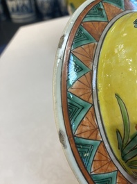 A pair of Chinese famille verte yellow-ground 'pheasants and peonies' vases and covers, 19th C.