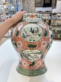 Two Chinese famille verte 'flowers and mythical animals' vases, 19th C.
