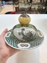 A pair of Chinese verte-biscuit 'cranes and flowers' vases and covers, 19th C.