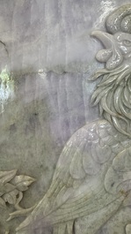A Chinese lavender and green jadeite 'phoenix' plaque in a hongmu frame, early 20th C.