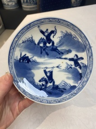 A set of 11 Chinese blue and white 'rabbit hunt' cups and saucers, Qianlong mark, 19th C.