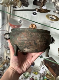 A Chinese archaic bronze tripod food vessel, 'dun 敦', Eastern Zhou