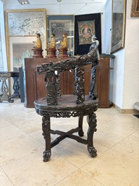 A pair of Chinese finely carved hongmu swivel chairs, Canton, 19th C.