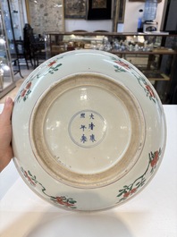 A Chinese wucai dish with floral design, Kangxi mark and of the period