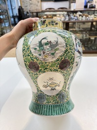 A pair of Chinese verte-biscuit 'cranes and flowers' vases and covers, 19th C.
