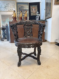 A pair of Chinese finely carved hongmu swivel chairs, Canton, 19th C.