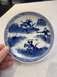 A set of 11 Chinese blue and white 'rabbit hunt' cups and saucers, Qianlong mark, 19th C.
