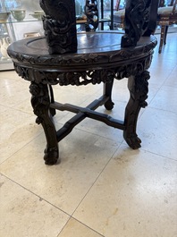 A pair of Chinese finely carved hongmu swivel chairs, Canton, 19th C.