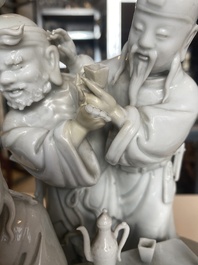 A Chinese Dehua blanc de Chine group of four deities on a boat, Republic