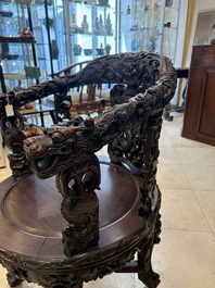 A pair of Chinese finely carved hongmu swivel chairs, Canton, 19th C.