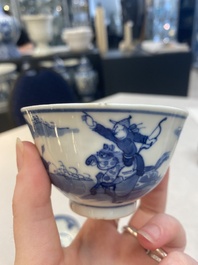 A set of 11 Chinese blue and white 'rabbit hunt' cups and saucers, Qianlong mark, 19th C.