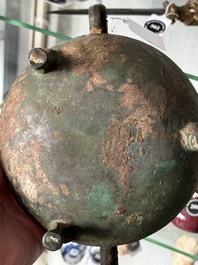 A Chinese archaic bronze tripod food vessel, 'dun 敦', Eastern Zhou