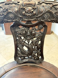 A pair of Chinese finely carved hongmu swivel chairs, Canton, 19th C.