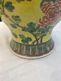 A pair of Chinese famille verte yellow-ground 'pheasants and peonies' vases and covers, 19th C.