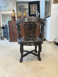 A pair of Chinese finely carved hongmu swivel chairs, Canton, 19th C.