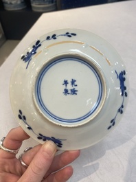 A set of 11 Chinese blue and white 'rabbit hunt' cups and saucers, Qianlong mark, 19th C.