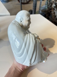 A Chinese gilt- and iron-red-decorated white-glazed Milefo Buddha, a famille rose vase and a brush pot, Qianlong and Xue Changseng 薛長森 mark, 20th C.