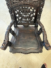 A pair of Chinese finely carved hongmu armchairs, Canton, 19th C.