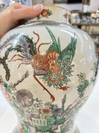A Chinese famille verte 'phoenixes' vase and cover, 19th C.