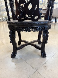 A pair of Chinese finely carved hongmu swivel chairs, Canton, 19th C.