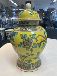 A pair of Chinese famille verte yellow-ground 'pheasants and peonies' vases and covers, 19th C.