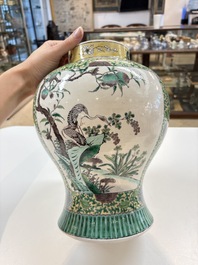 A pair of Chinese verte-biscuit 'cranes and flowers' vases and covers, 19th C.