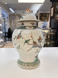 A Chinese famille verte 'phoenixes' vase and cover, 19th C.