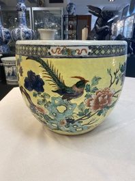 A Chinese famille rose yellow-ground 'pheasant and peony' scroll pot, 19th C.