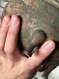 A Chinese archaic bronze tripod food vessel, 'dun 敦', Eastern Zhou