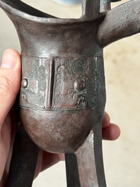 A Chinese archaic bronze wine vessel with taotie design, 'jue 爵', Zhou