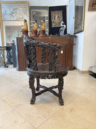 A pair of Chinese finely carved hongmu swivel chairs, Canton, 19th C.