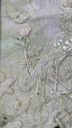 A Chinese lavender and green jadeite 'phoenix' plaque in a hongmu frame, early 20th C.