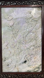 A Chinese lavender and green jadeite 'phoenix' plaque in a hongmu frame, early 20th C.