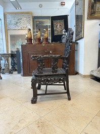 A pair of Chinese finely carved hongmu armchairs, Canton, 19th C.