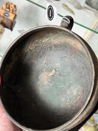 A Chinese archaic bronze tripod food vessel, 'dun 敦', Eastern Zhou