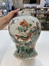 A Chinese famille verte 'phoenixes' vase and cover, 19th C.
