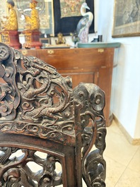 A pair of Chinese finely carved hongmu armchairs, Canton, 19th C.