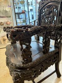 A pair of Chinese finely carved hongmu armchairs, Canton, 19th C.