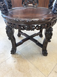 A pair of Chinese finely carved hongmu swivel chairs, Canton, 19th C.