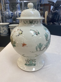 Two Chinese famille verte 'birds and flowers' vases and covers, 19th C.