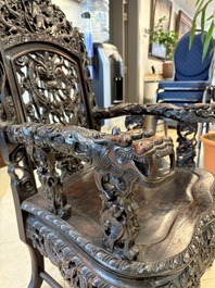 A pair of Chinese finely carved hongmu armchairs, Canton, 19th C.