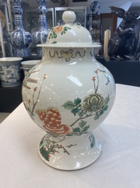 Two Chinese famille verte 'birds and flowers' vases and covers, 19th C.