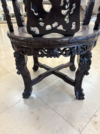A pair of Chinese finely carved hongmu swivel chairs, Canton, 19th C.