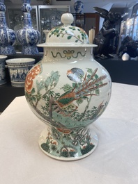 Two Chinese famille verte 'birds and flowers' vases and covers, 19th C.