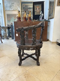 A pair of Chinese finely carved hongmu swivel chairs, Canton, 19th C.