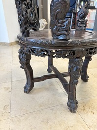 A pair of Chinese finely carved hongmu swivel chairs, Canton, 19th C.
