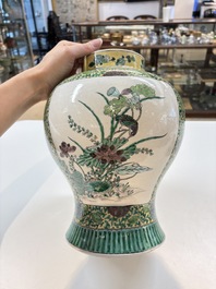 A pair of Chinese verte-biscuit 'cranes and flowers' vases and covers, 19th C.